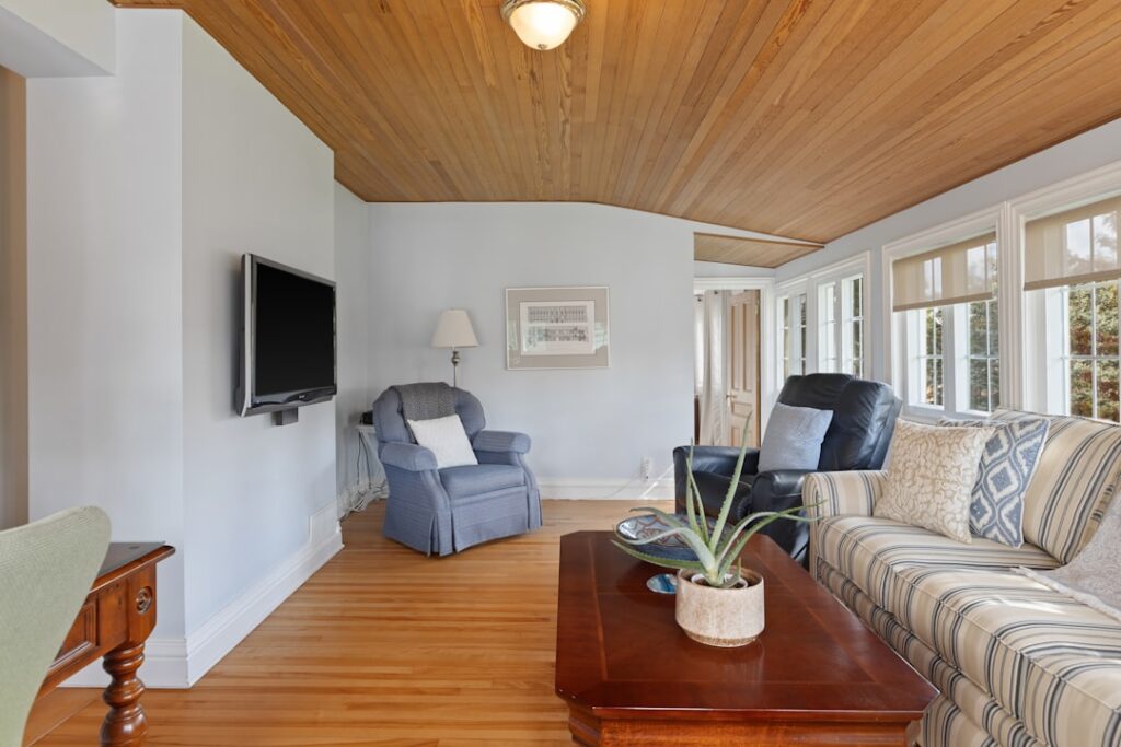 Natural pine tongue and groove ceiling in a bright farmhouse living room