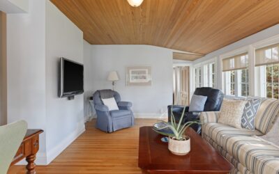 Natural pine tongue and groove ceiling in a bright farmhouse living room