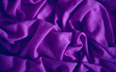 Close-up view of a soft, plush Triexta carpet in a modern bedroom setting