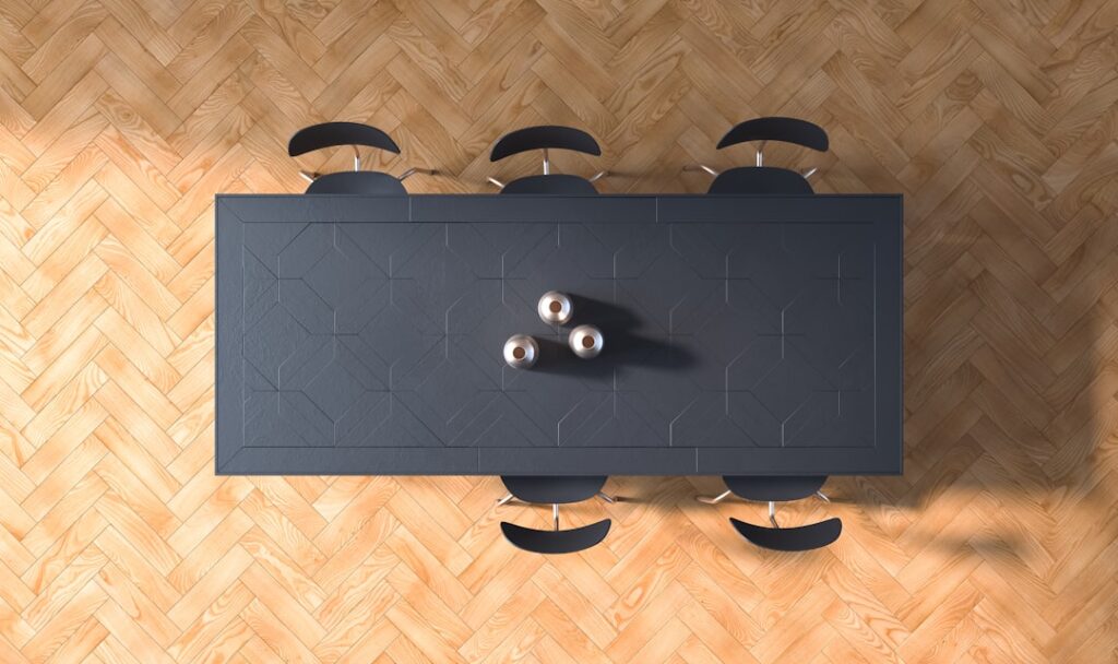 Close-up of click-lock vinyl plank flooring being snapped together during installation