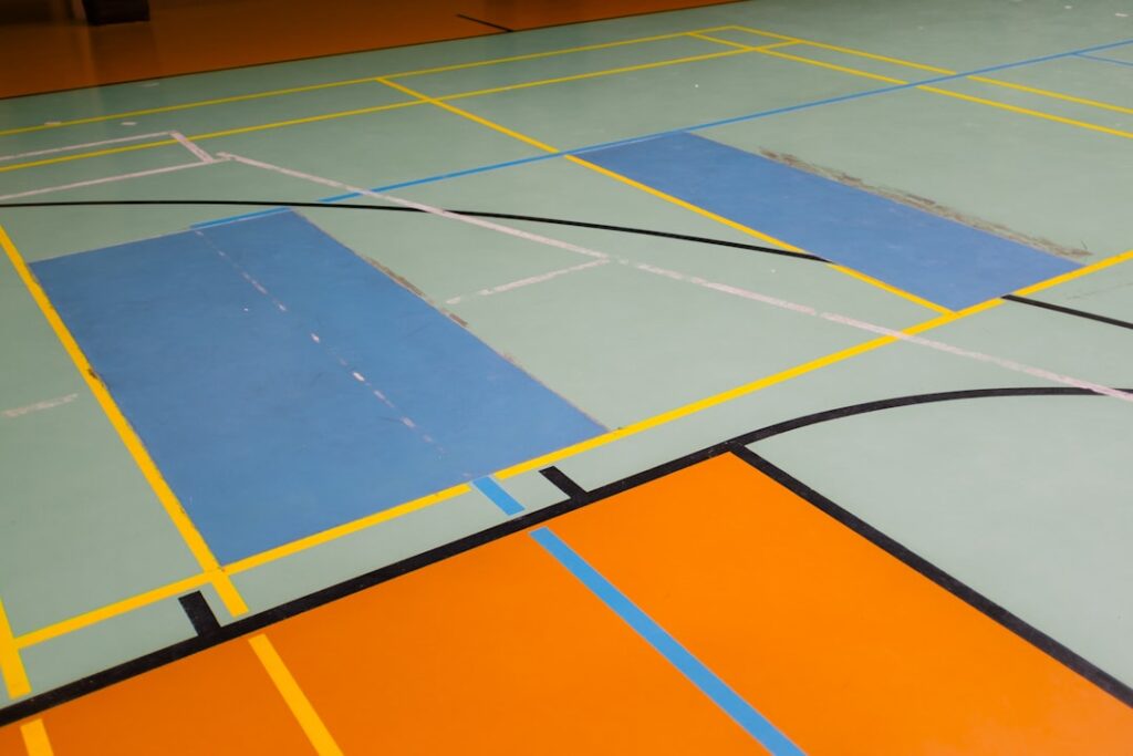 Applying vinyl flooring adhesive with a trowel on a subfloor