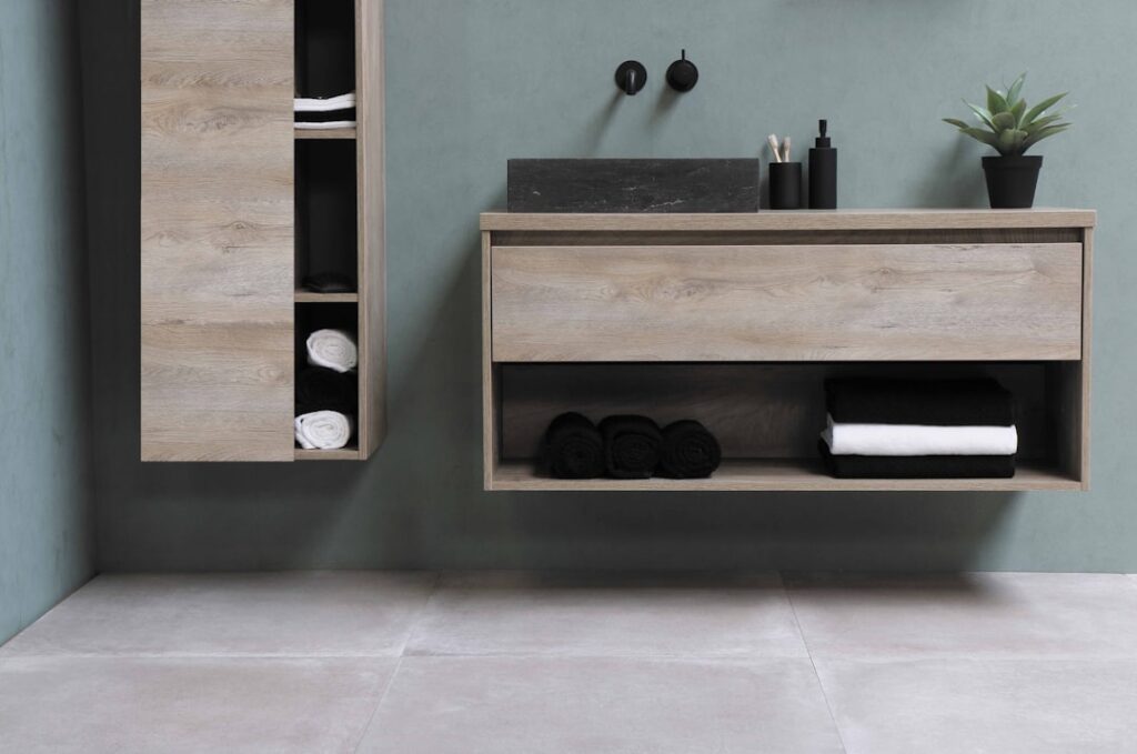 Modern bathroom with waterproof vinyl flooring in a stone-look pattern