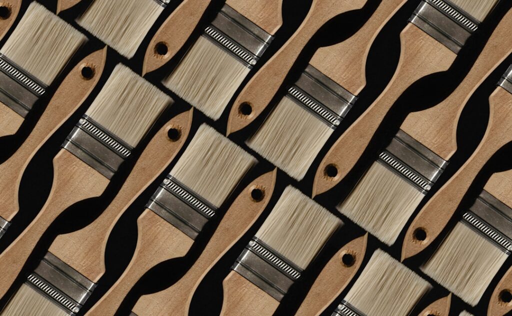 Applying vinyl flooring adhesive to a subfloor with a notched trowel