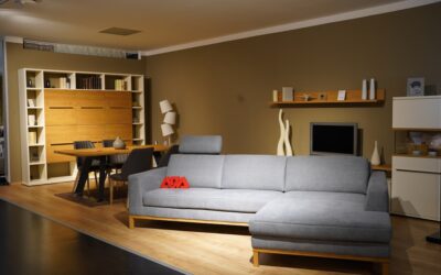 Light oak vinyl plank flooring installed in a modern open-concept living room with natural light