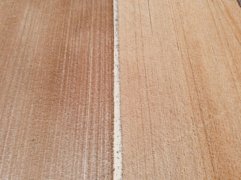 Side-by-side view of vinyl plank and hardwood flooring in a home