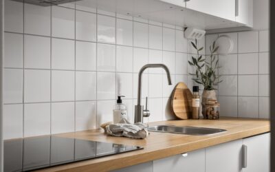 Water resistant laminate flooring installed in a bright modern kitchen