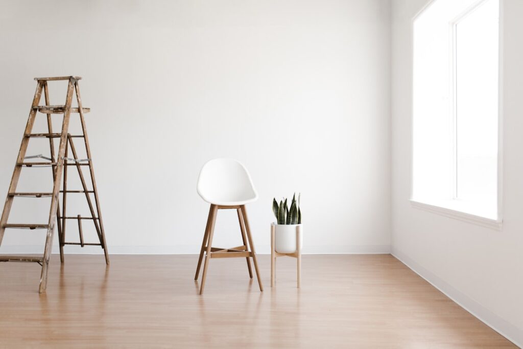 Bright living room with white vinyl plank flooring and natural light