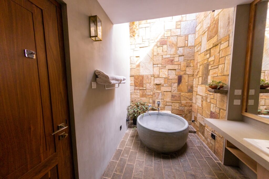 Wood look porcelain tile planks installed in a modern bathroom