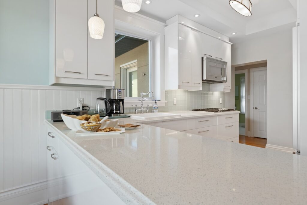 Thin granite countertop overlay being installed over existing laminate in a kitchen