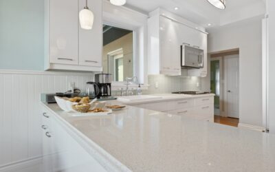 Thin granite countertop overlay being installed over existing laminate in a kitchen
