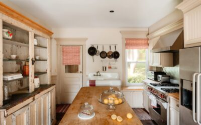 Farmhouse kitchen with white subway tile backsplash and open wood shelving