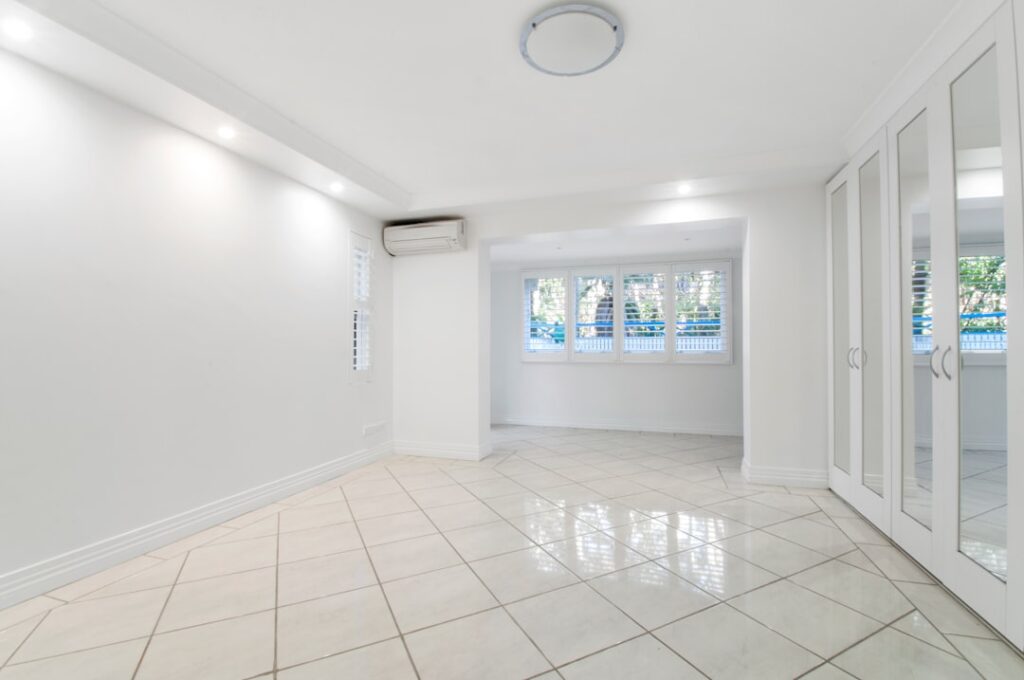 Large format grey porcelain floor tiles in a modern living room