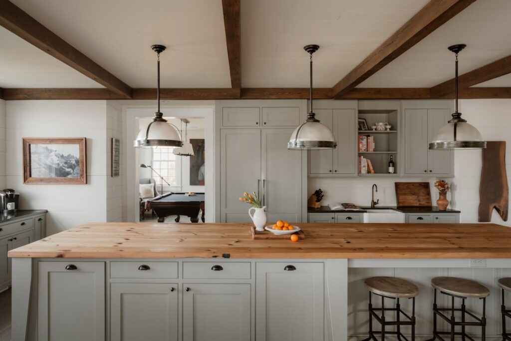 Clean wooden butcher block countertop in a bright kitchen