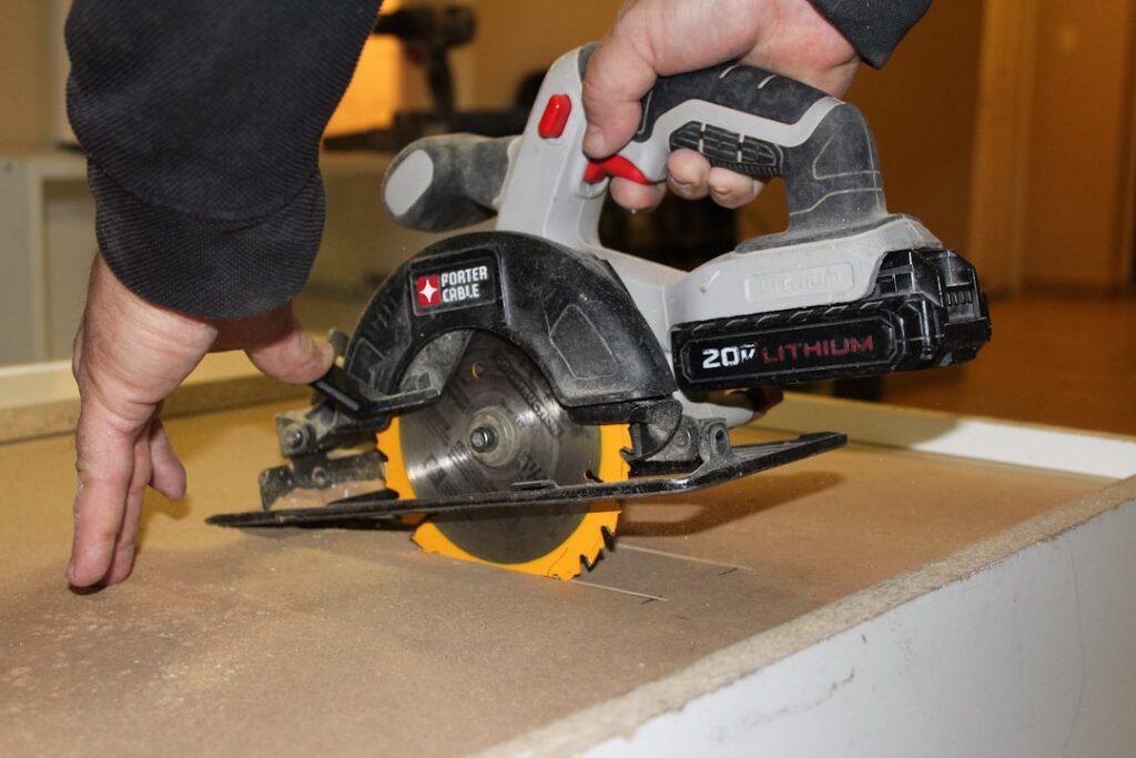 Person using a circular saw to make a precise cut on a laminate countertop