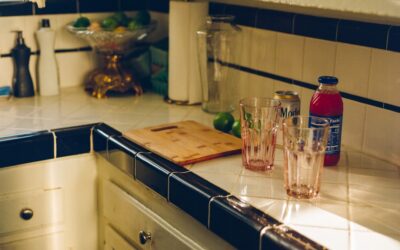 Clean finished backsplash edge on an open kitchen wall with metal trim