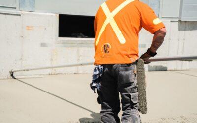 Self-leveling compound being poured on concrete floor in preparation for new flooring