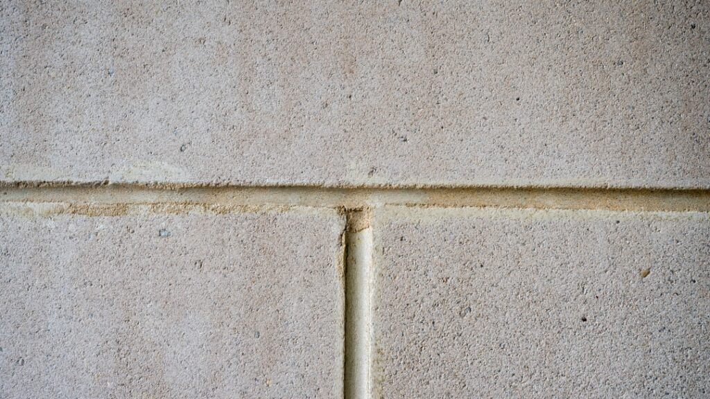 Close-up of tile grout lines showing the difference between sanded and unsanded grout