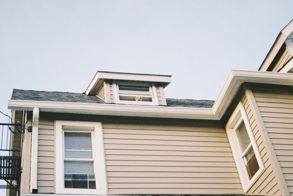 New vinyl siding being installed on the exterior of a house